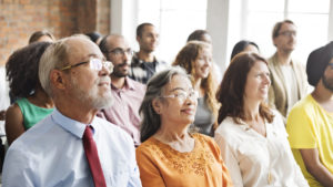 Group of people listening to a presentation