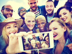 Large group taking a selfie on a phone