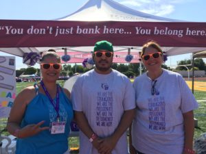 Employees in front of Relay for Life Booth
