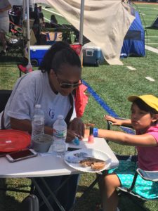 Employee helping Child