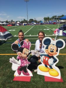 Employees posing with cut-outs