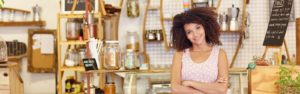 Young woman in her local shop