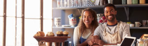 Couple smiling in a bakery