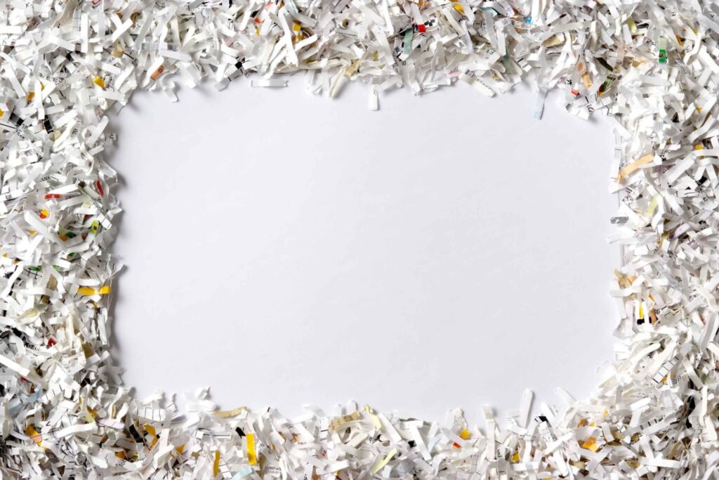 Frame Of The Shredded Paper On White Background UNCLE Credit Union