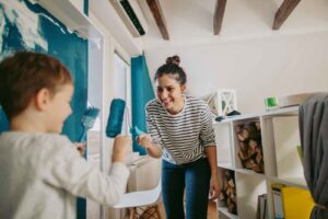 Mom and son painting bedroom