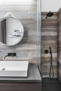 Modern bathroom with shower and wood effect tiling