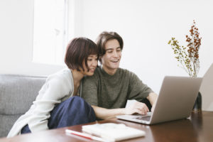 Young Couple Looking at Computer Together