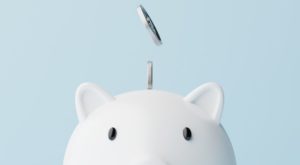 Closeup piggy bank and silver coins falling. 3d rendering illustration