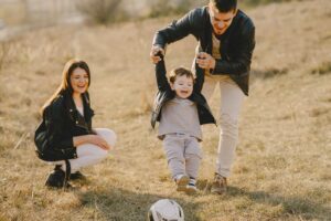 Family Having Fun With Soccer Ball