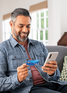 Man Holding UNCLE Debit Card