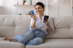 Woman Holding UNCLE Debit Card