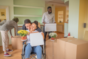 Couple moving into new home with friends helping