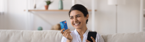 Woman Holding UNCLE Debit Card