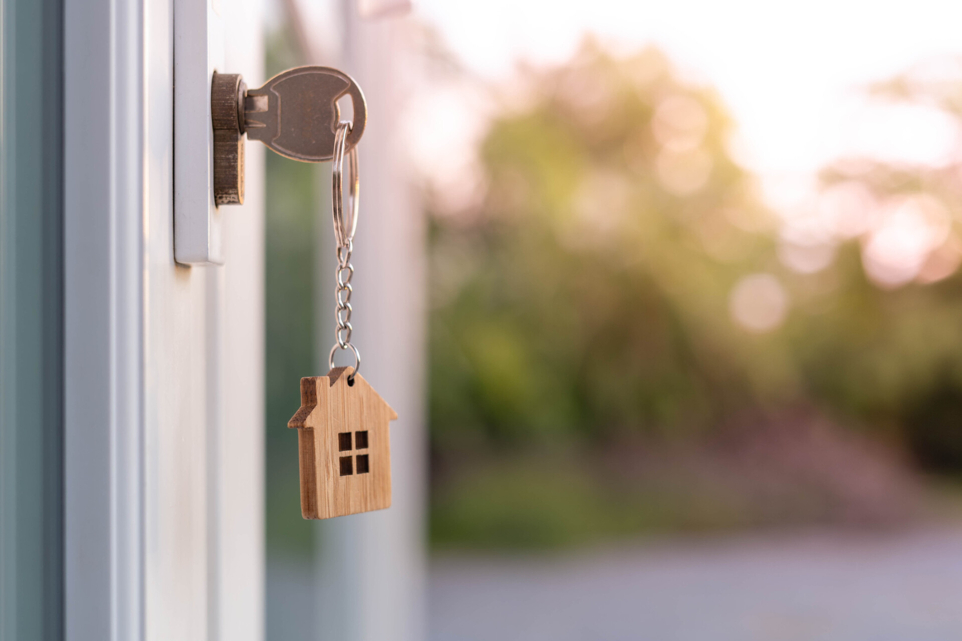 House key inserted in front door.