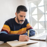 Mature Man Working At Home