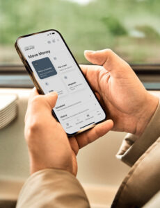 Move Money screen on mobile device in person's hand