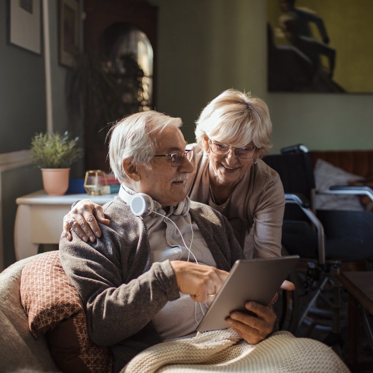 Close up of a senior couple using a tablet at home