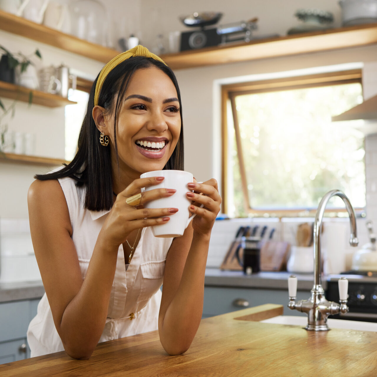 Happy Woman, Coffee Or Tea In Home Kitchen And Relax With A Smile In The Morning At House.